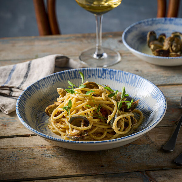 Churchill Inked Cascade Indigo Coupe Bowl with seafood linguine pasta, paired with Churchill Tanner Vintage Cutlery