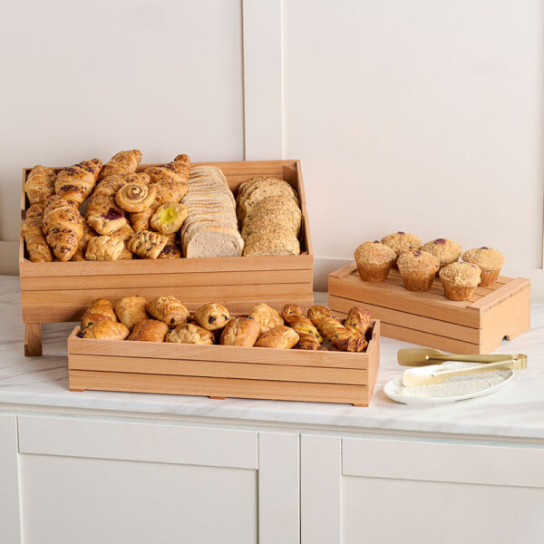 Comas Breakfast Buffet Wooden Boxes in Brown presenting an array of bread rolls on a kitchen tabletop