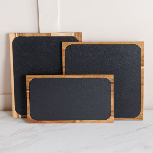 Comas Buffet Slate Trays in Black stood upright against the wall to showcase the full product