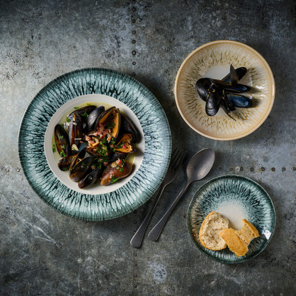 Churchill Inked Lume Midnight Blue Wide Rim Bowl and Inked Lume Natural Coupe Plate serving up clams and seafood dishes