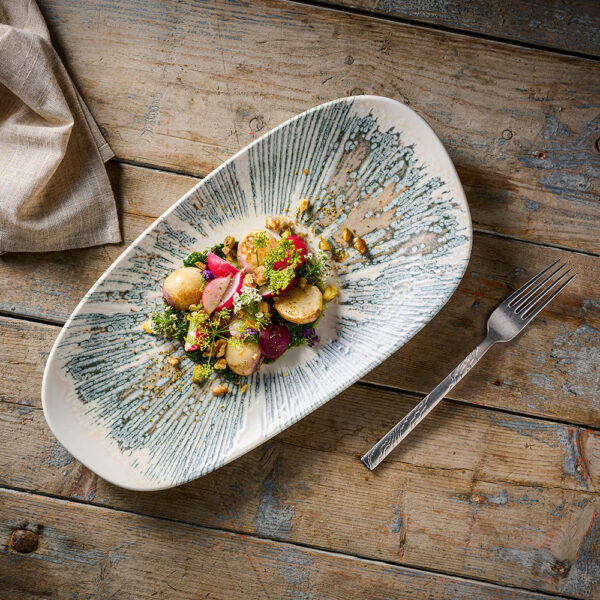 Churchill Inked Lyra Pink Oblong Platter showcasing a fresh radish salad on a brown tabletop