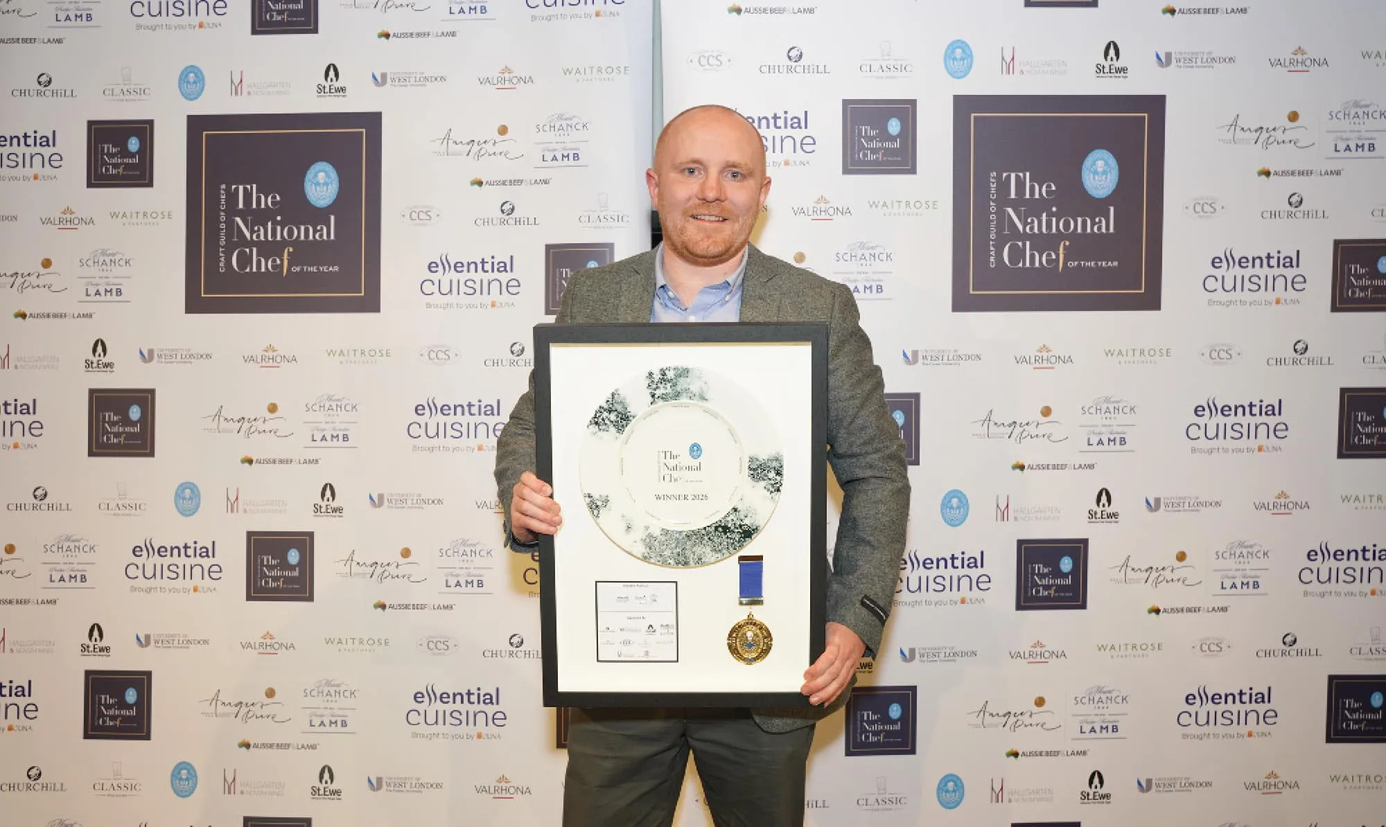 National Chef of the Year winner holding framed Churchill Alchemy Smoke plate