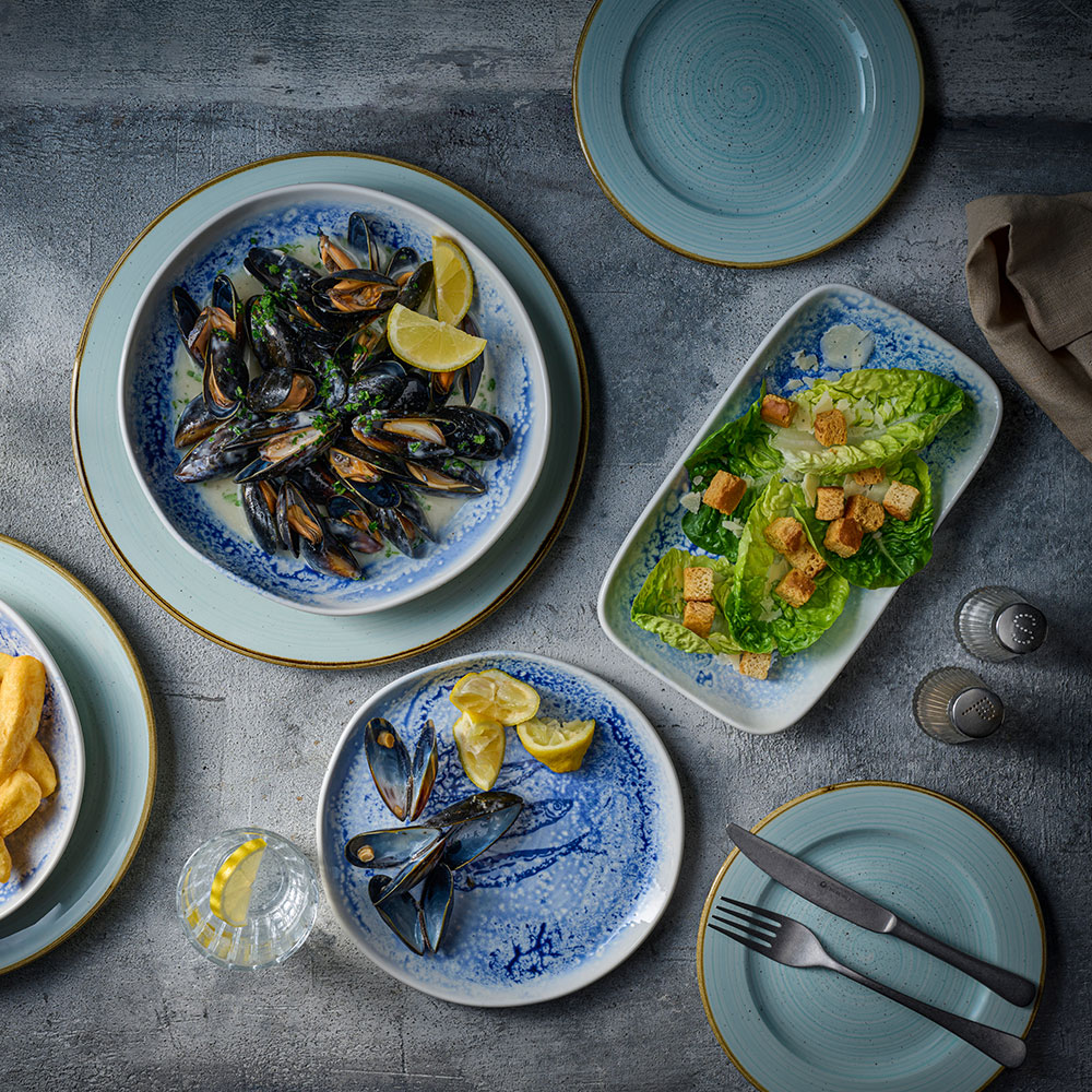 ChurchillInked Fresco mussels and chips dish spread on grey tabletop