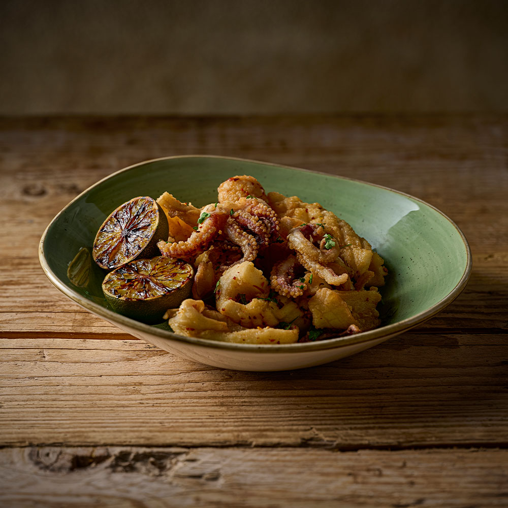 Churchill Stonecast Sage Green opal bowl filled with calamari
